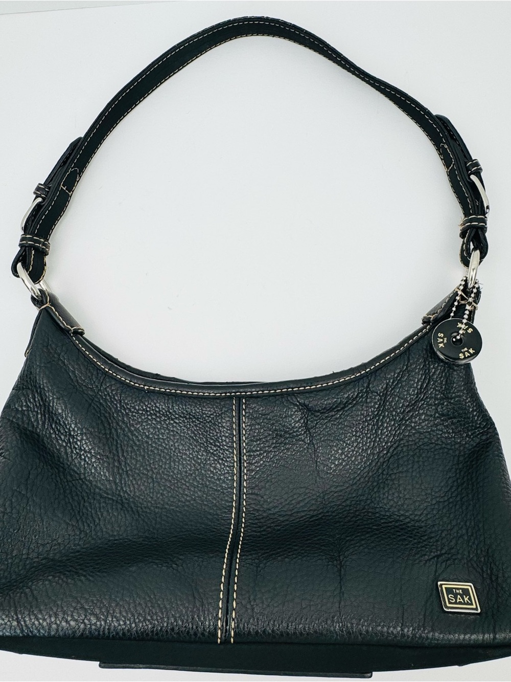 The Sak Baggett hobo. Pebbled leather. Silver-tone hardware. Slouchy Y2K style